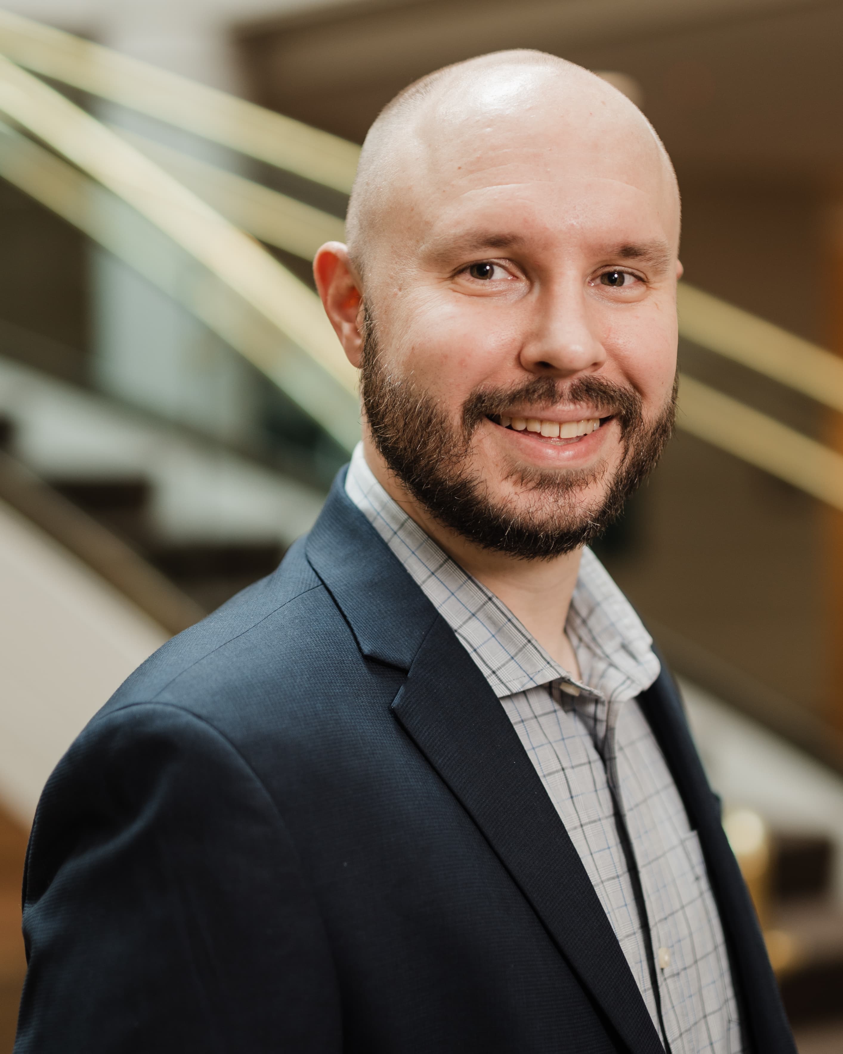 Professional headshot of Curtis Szmania